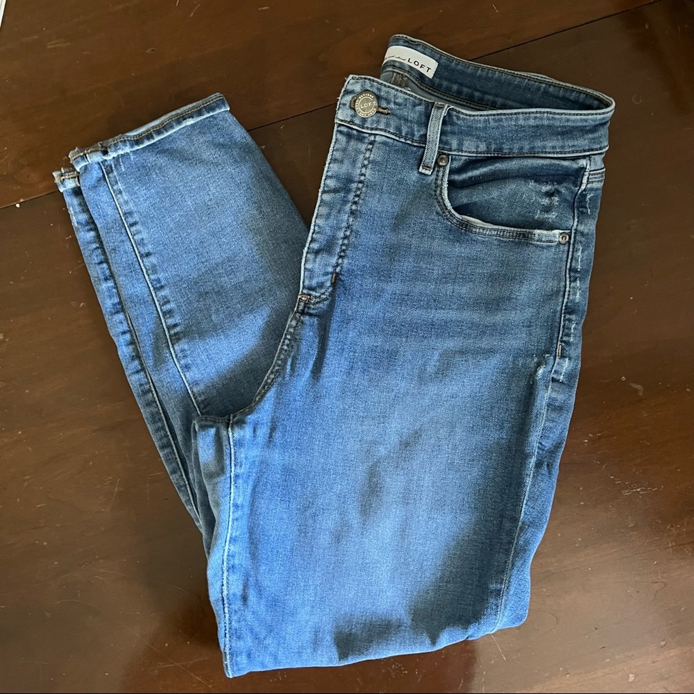 Faded jeans with distressing